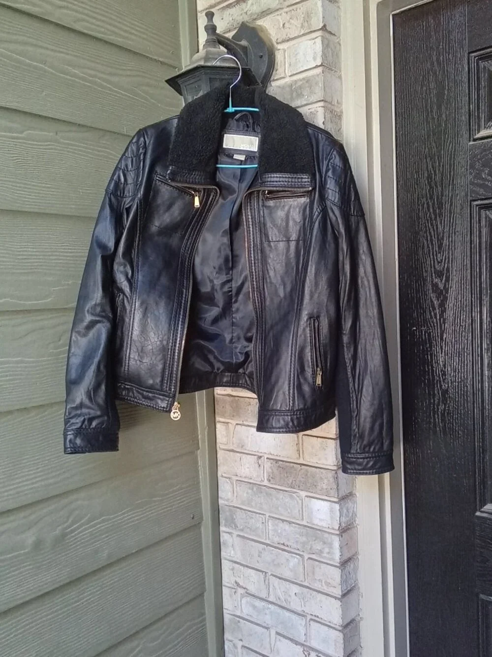 Michael Kors women's leather jacket in size M features a stylish sherpa collar